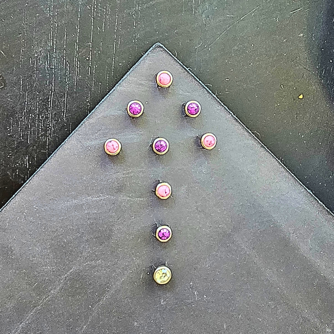 purple and pink stones on a yoga mat