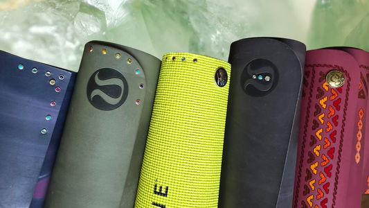 yoga mats with yoga mat charms in different designs