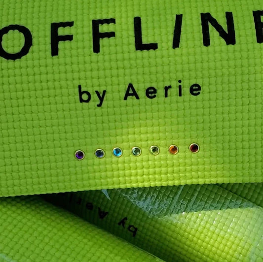 Gold gem yoga mat charms installed in an aerie offline yoga mat