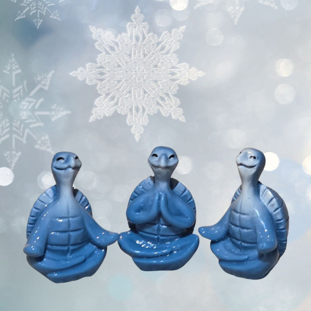 mini blue turtle in lotus pose doing yoga